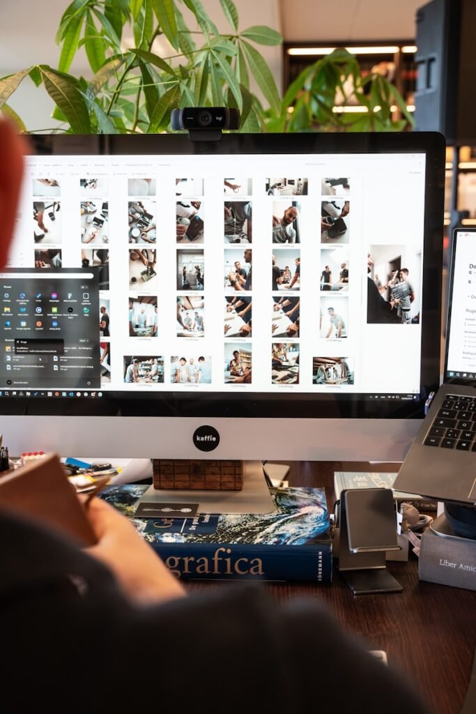 A man sitting in front of a computer on a desk